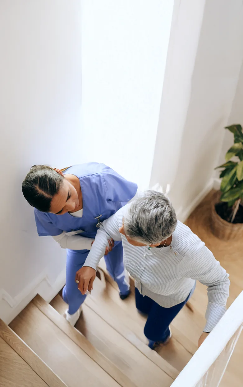 A closeup of a nurse and patients hands.