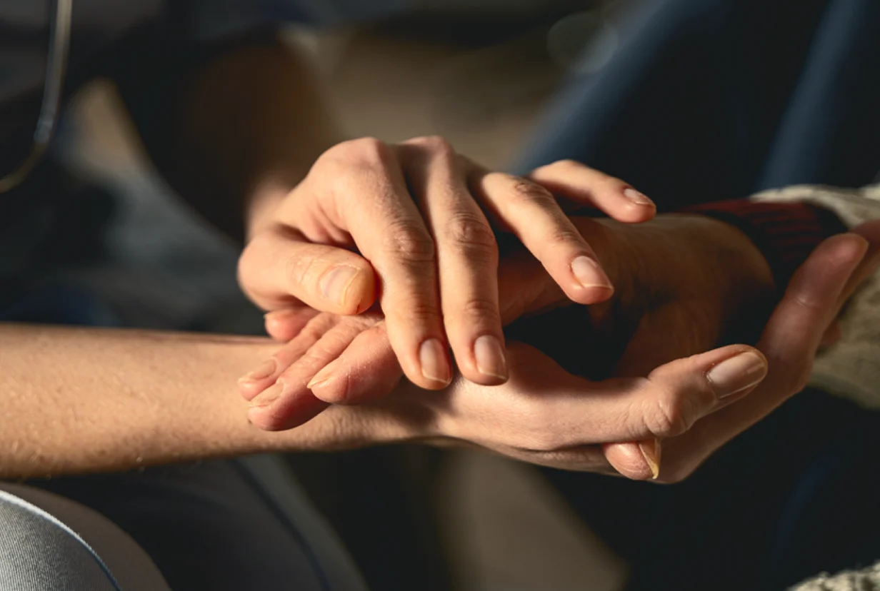 Close up of holding hands.